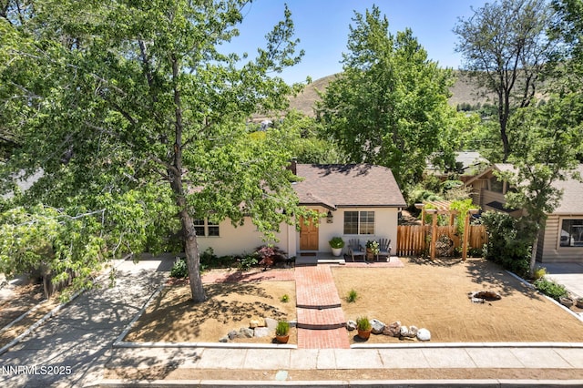 705 Elm St, Carson City, NV 89703 - view of front of property with roof with shingles and stucco siding
