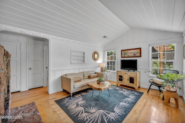 705 Elm St, Carson City, NV 89703 - living area featuring wood-type flooring, vaulted ceiling, healthy amount of natural light, a wainscoted wall, and wood ceiling
