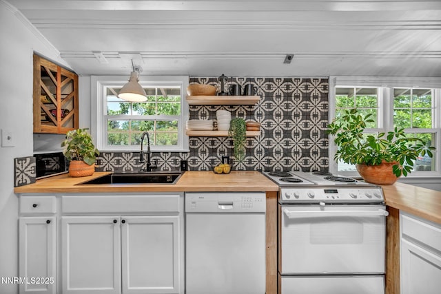 705 Elm St, Carson City, NV 89703 - kitchen featuring white appliances, wood counters, decorative backsplash, and white cabinetry