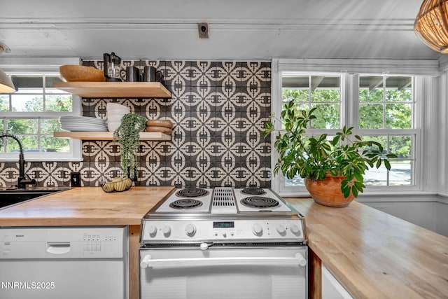 705 Elm St, Carson City, NV 89703 - kitchen featuring range with electric cooktop, wooden counters, white dishwasher, open shelves, and plenty of natural light