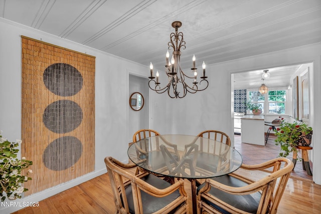 705 Elm St, Carson City, NV 89703 - dining room with a chandelier, light wood-style floors, and ornamental molding