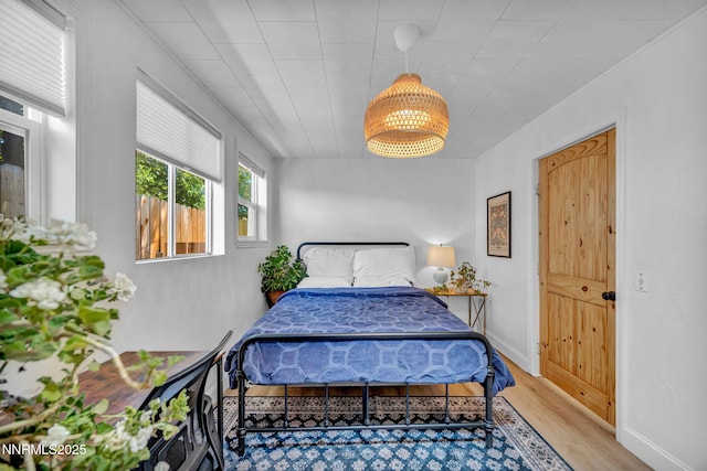 705 Elm St, Carson City, NV 89703 - bedroom featuring wood finished floors and baseboards
