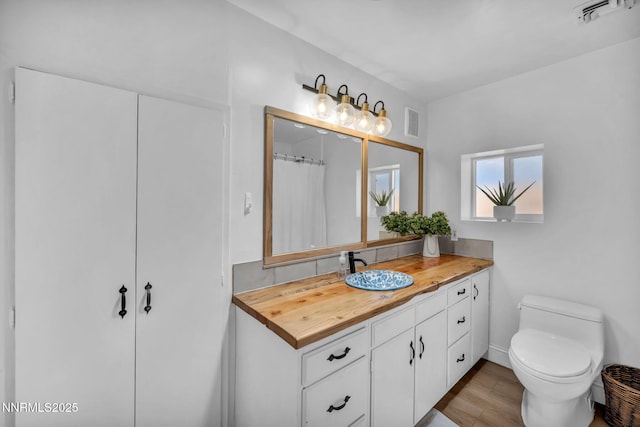 705 Elm St, Carson City, NV 89703 - bathroom featuring vanity and wood finished floors