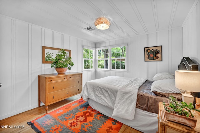 705 Elm St, Carson City, NV 89703 - bedroom featuring a decorative wall and light wood-style floors