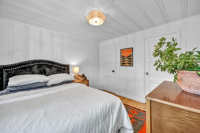 705 Elm St, Carson City, NV 89703 - bedroom featuring light wood finished floors and a decorative wall