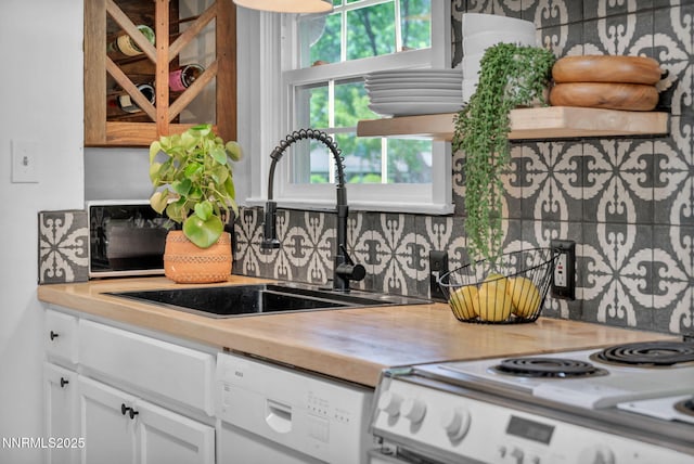 705 Elm St, Carson City, NV 89703 - kitchen featuring white appliances, backsplash, white cabinetry, and open shelves