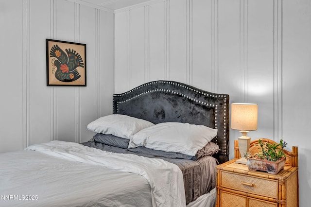 705 Elm St, Carson City, NV 89703 - bedroom with a decorative wall and ornamental molding