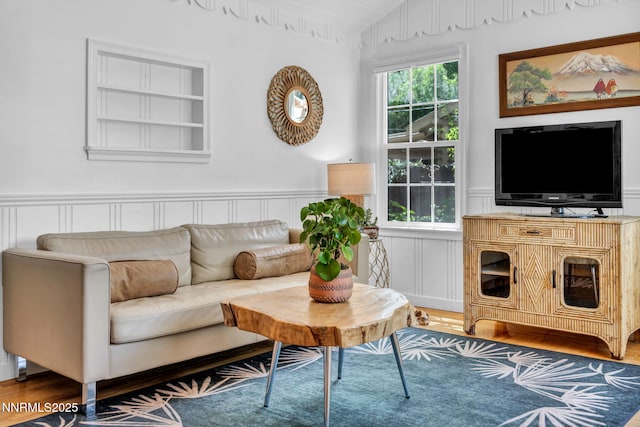 705 Elm St, Carson City, NV 89703 - living room with vaulted ceiling, wood finished floors, a decorative wall, and a wainscoted wall