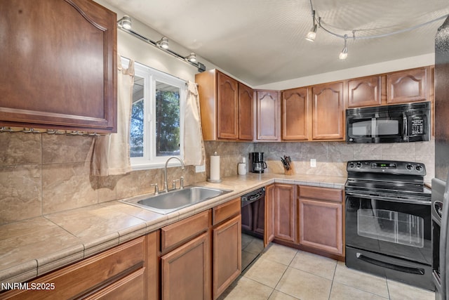 3310 Delna Dr, Sparks, NV 89431 - kitchen featuring black appliances, tile counters, light tile patterned flooring, and backsplash