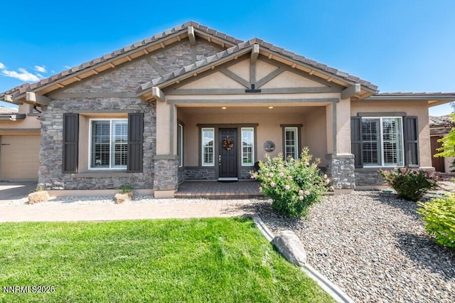 9800 Hafflinger Ln, Reno, NV 89521 - craftsman house featuring stone siding, covered porch, a front lawn, a garage, and stucco siding