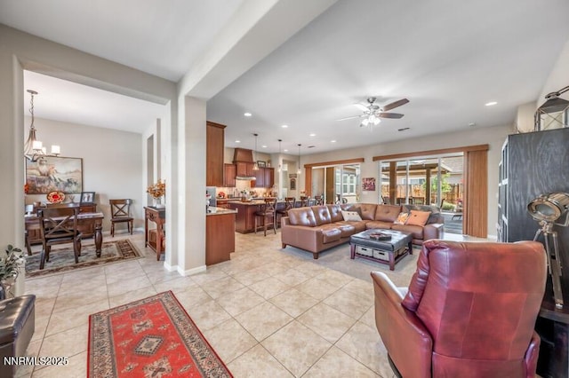9800 Hafflinger Ln, Reno, NV 89521 - living area featuring light tile patterned floors, a ceiling fan, a chandelier, and recessed lighting