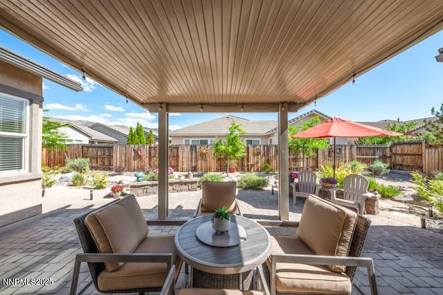 9800 Hafflinger Ln, Reno, NV 89521 - fenced backyard with a patio and an outdoor living space