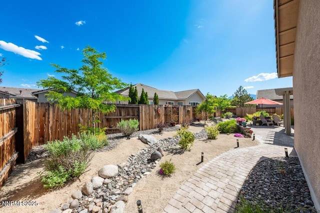 9800 Hafflinger Ln, Reno, NV 89521 - fenced backyard featuring a patio area