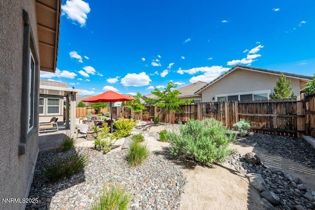 9800 Hafflinger Ln, Reno, NV 89521 - fenced backyard with a patio