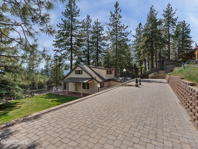 605 Jerry Dr, Zephyr Cove, NV 89448 - view of front facade with metal roof and driveway