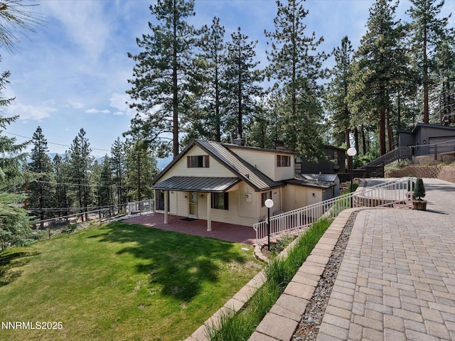 605 Jerry Dr, Zephyr Cove, NV 89448 - view of home's exterior with metal roof and covered porch