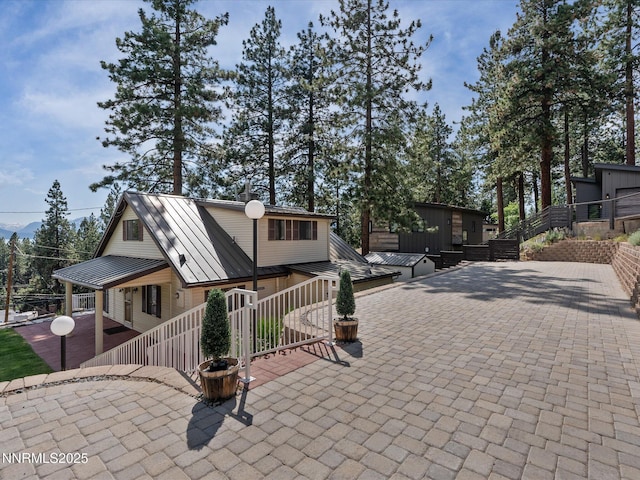 605 Jerry Dr, Zephyr Cove, NV 89448 - back of house with a standing seam roof, a patio, and metal roof