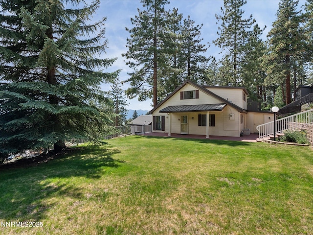 605 Jerry Dr, Zephyr Cove, NV 89448 - rear view of property featuring metal roof and a standing seam roof