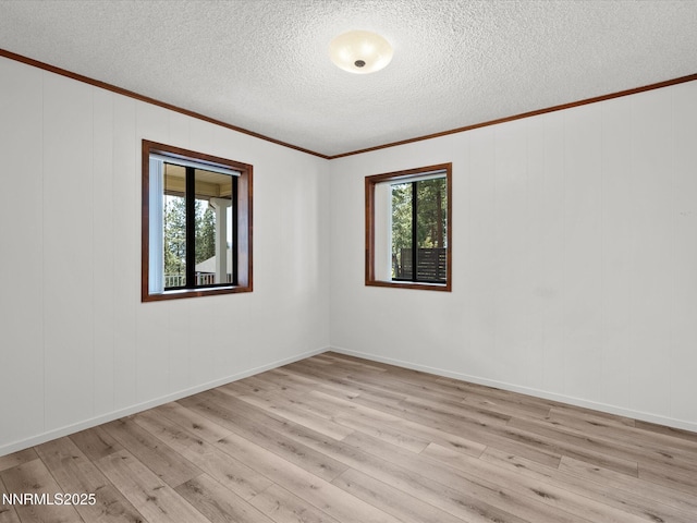 605 Jerry Dr, Zephyr Cove, NV 89448 - unfurnished room with crown molding, light wood-type flooring, and a textured ceiling