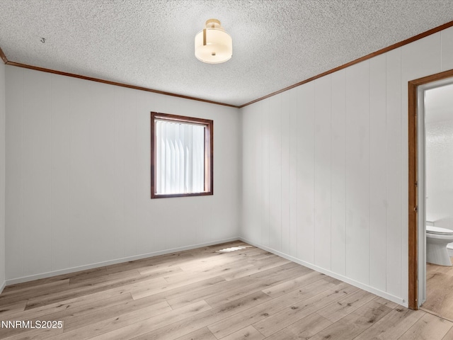 605 Jerry Dr, Zephyr Cove, NV 89448 - empty room with a textured ceiling, wood finished floors, and crown molding