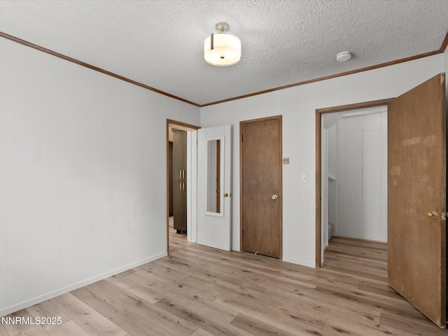 605 Jerry Dr, Zephyr Cove, NV 89448 - unfurnished bedroom featuring crown molding, wood finished floors, and a textured ceiling