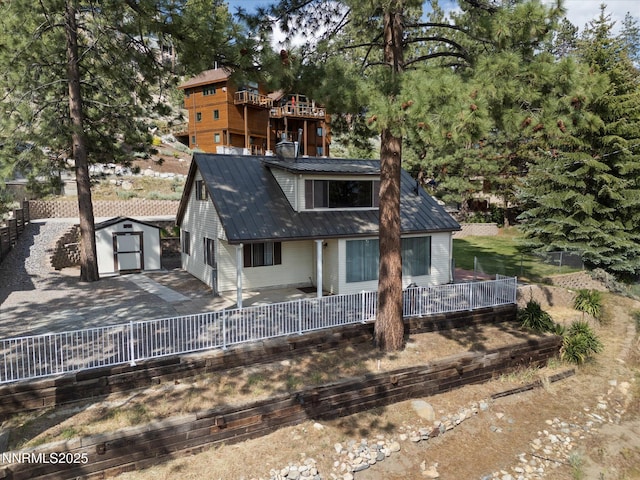 605 Jerry Dr, Zephyr Cove, NV 89448 - back of property featuring metal roof and driveway