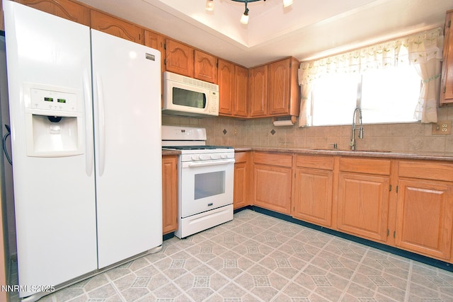35 Count Fleet Ct, Reno, NV 89502 - kitchen featuring white appliances, backsplash, and a raised ceiling