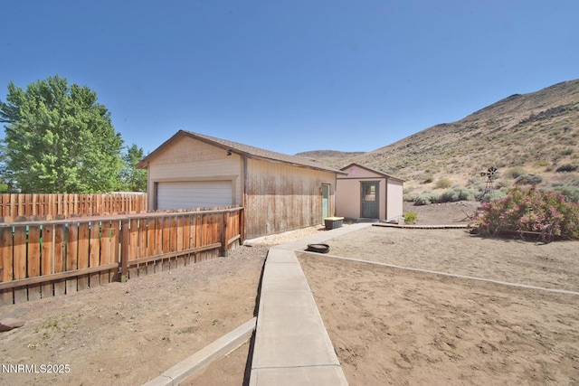 35 Count Fleet Ct, Reno, NV 89502 - view of front of home featuring a mountain view, a garage, and an outdoor structure