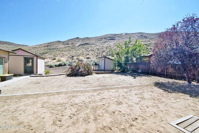 35 Count Fleet Ct, Reno, NV 89502 - view of yard featuring a storage unit and a mountain view