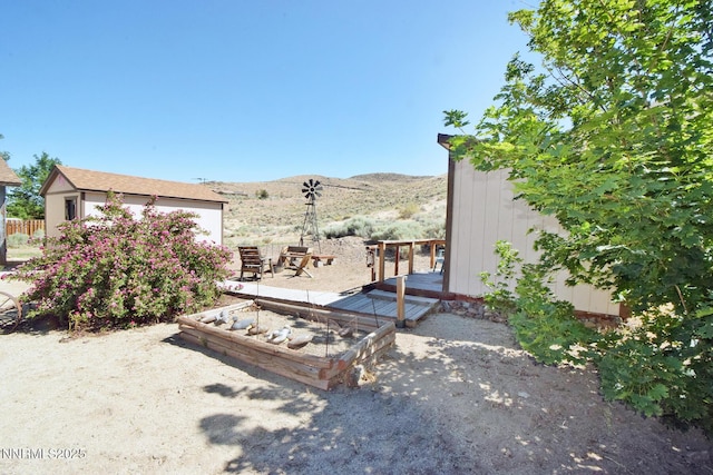35 Count Fleet Ct, Reno, NV 89502 - view of yard featuring a mountain view and a garden