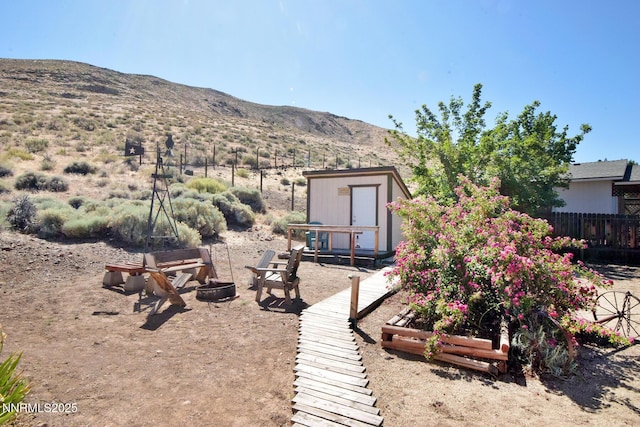 35 Count Fleet Ct, Reno, NV 89502 - view of yard featuring a mountain view and an outdoor fire pit