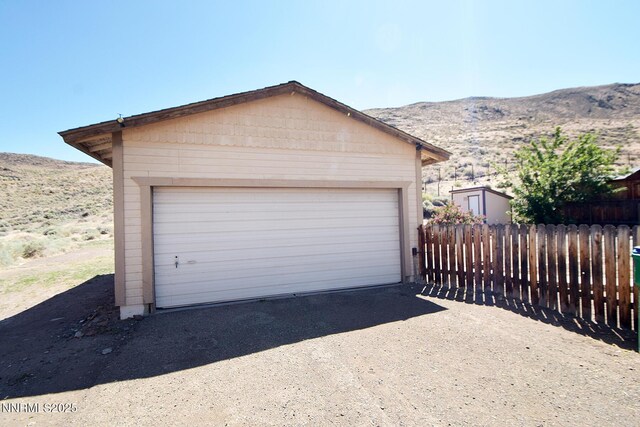 35 Count Fleet Ct, Reno, NV 89502 - garage featuring a mountain view