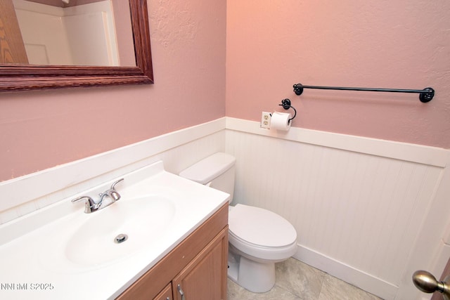 35 Count Fleet Ct, Reno, NV 89502 - bathroom featuring wainscoting and vanity