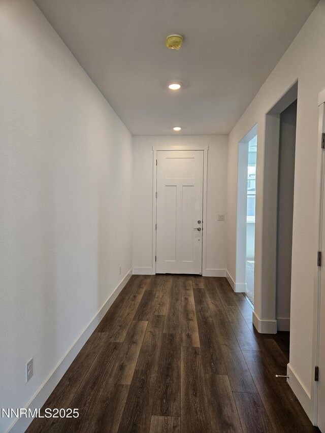 1224 Heybourne Rd, Gardnerville, NV 89410 - hall featuring dark wood finished floors, baseboards, and recessed lighting