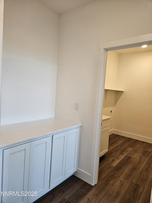 1224 Heybourne Rd, Gardnerville, NV 89410 - hallway with dark wood-type flooring and baseboards