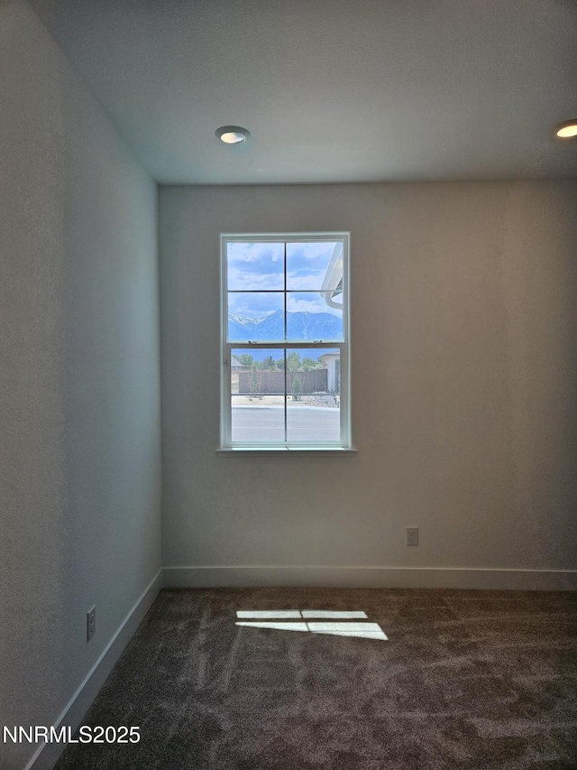1224 Heybourne Rd, Gardnerville, NV 89410 - spare room featuring dark colored carpet, baseboards, and recessed lighting