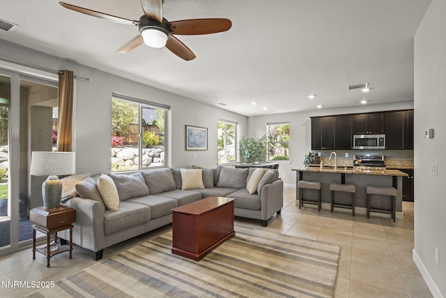 1775 Samantha Crest Trl, Reno, NV 89523 - living area with light tile patterned floors, a ceiling fan, and recessed lighting