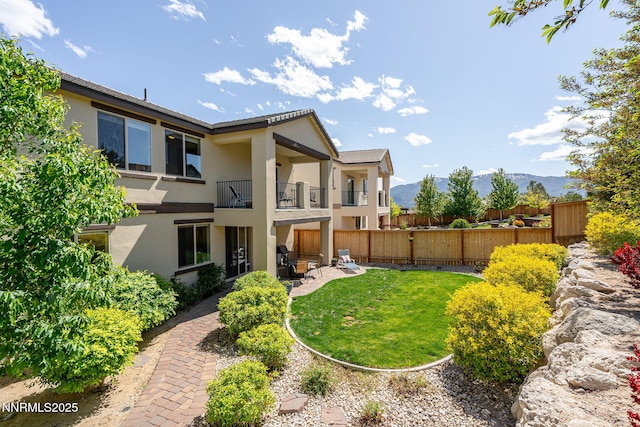 1775 Samantha Crest Trl, Reno, NV 89523 - back of property featuring stucco siding, a balcony, a patio area, and a mountain view