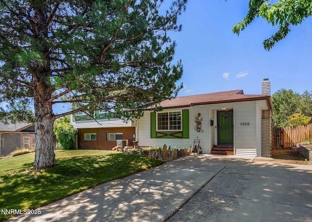 3505 Everett Dr, Reno, NV 89503 - view of front of house with a chimney, entry steps, and driveway