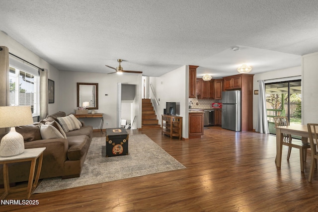 3505 Everett Dr, Reno, NV 89503 - living room featuring healthy amount of natural light, dark wood-style floors, and a textured ceiling