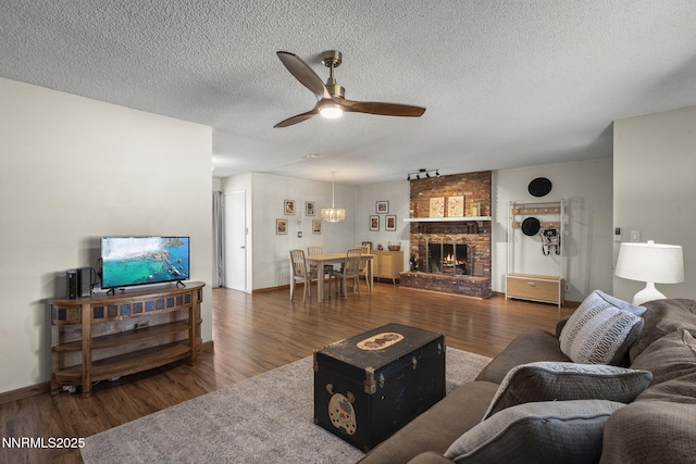 3505 Everett Dr, Reno, NV 89503 - living room with a ceiling fan, wood finished floors, a textured ceiling, and a fireplace
