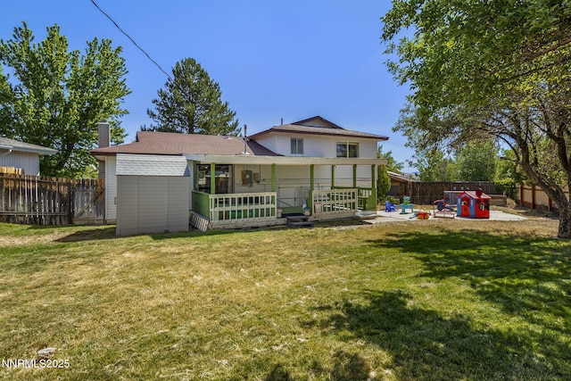 3505 Everett Dr, Reno, NV 89503 - back of house with a patio area, a fenced backyard, and a chimney