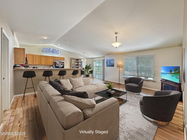 2657 Elizabeth Pkwy, Fallon, NV 89406 - living area with light wood-style floors, lofted ceiling, and baseboards