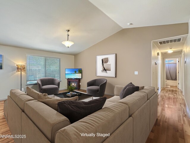 2657 Elizabeth Pkwy, Fallon, NV 89406 - living room featuring wood finished floors, vaulted ceiling, and baseboards