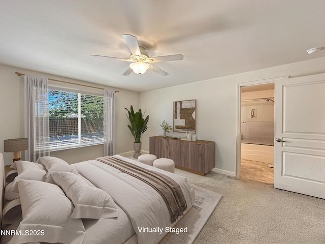2657 Elizabeth Pkwy, Fallon, NV 89406 - bedroom featuring light colored carpet, ensuite bath, ceiling fan, and baseboards