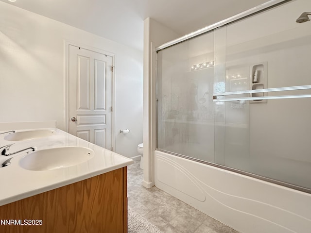 2657 Elizabeth Pkwy, Fallon, NV 89406 - bathroom with toilet, combined bath / shower with glass door, double vanity, and tile patterned floors