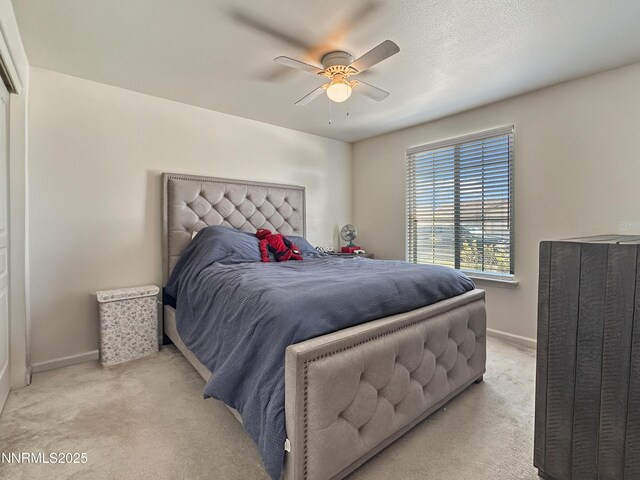 2657 Elizabeth Pkwy, Fallon, NV 89406 - bedroom featuring light colored carpet, baseboards, and ceiling fan