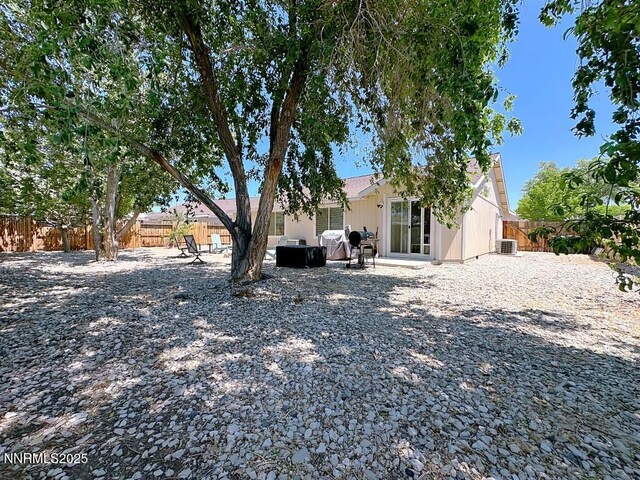 2657 Elizabeth Pkwy, Fallon, NV 89406 - back of house with a fenced backyard, central AC unit, and a patio area