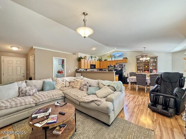 2657 Elizabeth Pkwy, Fallon, NV 89406 - living area with vaulted ceiling, light wood finished floors, and a chandelier