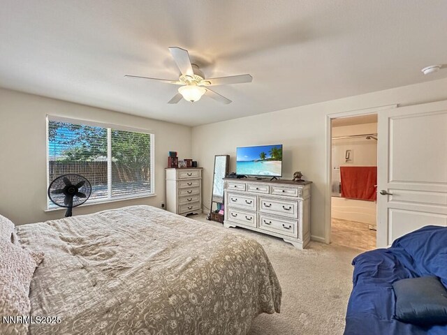 2657 Elizabeth Pkwy, Fallon, NV 89406 - bedroom with light colored carpet, ceiling fan, and ensuite bathroom